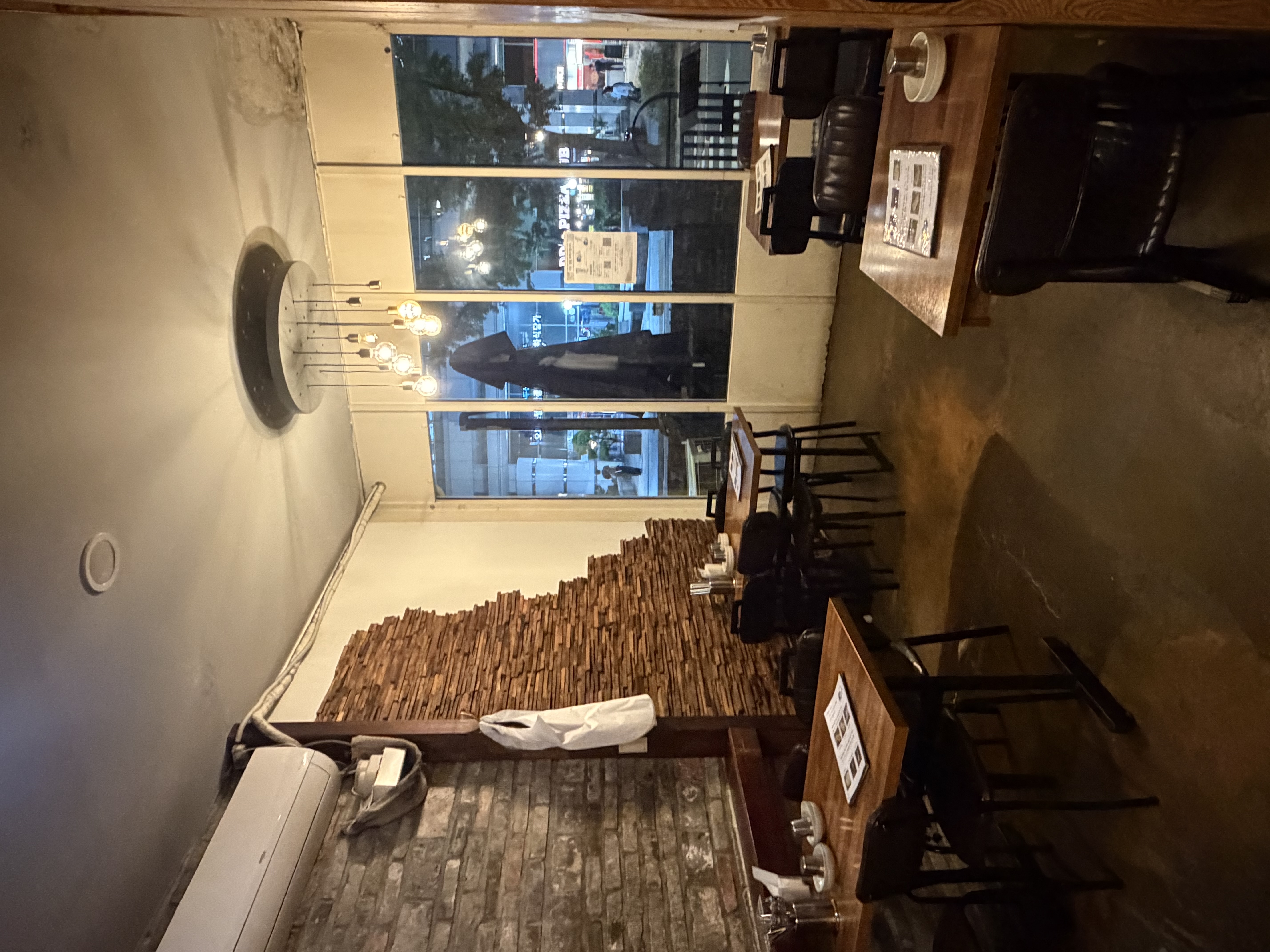 Evening interior of Jongno Dodam with oak tables